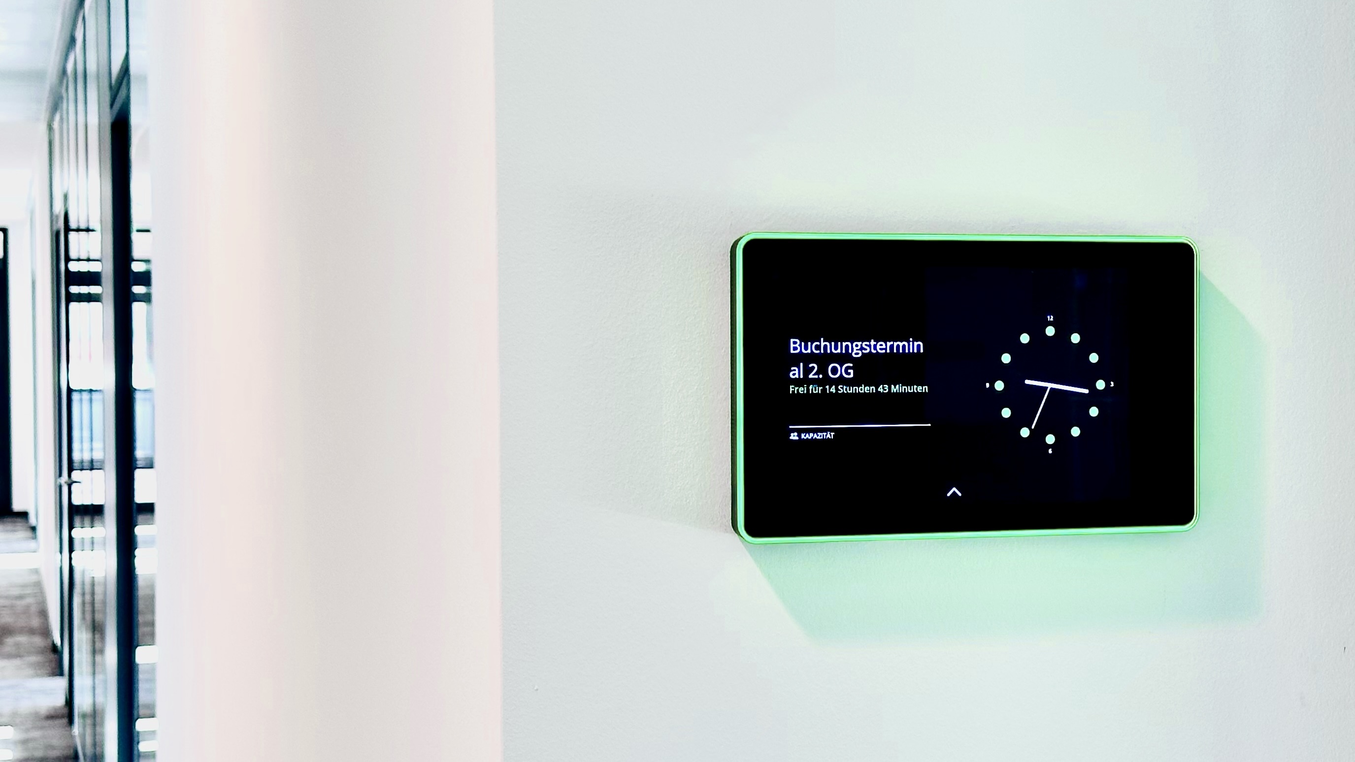 HXA Room Booking touch display with green LED frame outside a meeting room