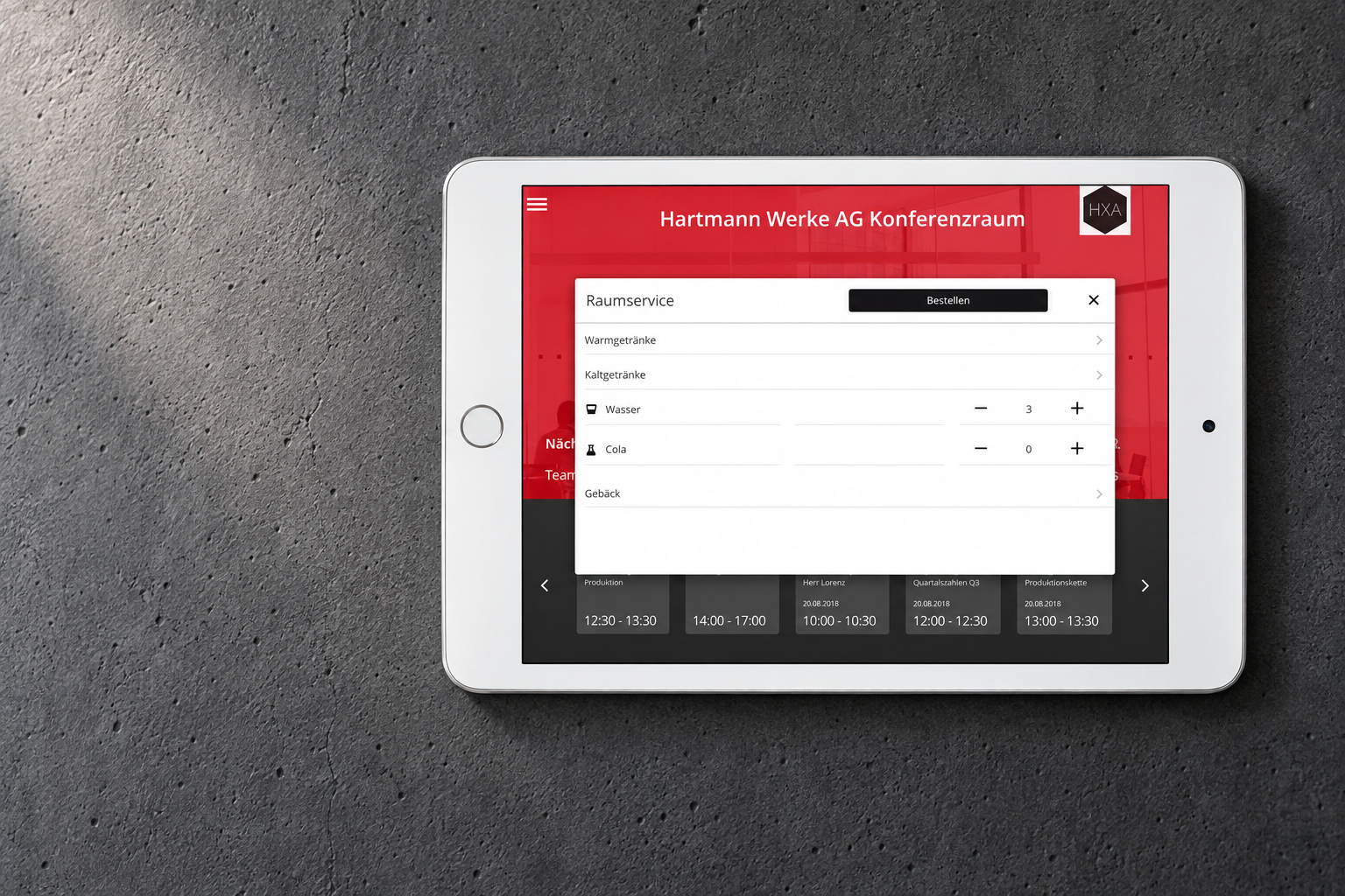 Wall-mounted HXA Room Booking iPad with a Room Service order